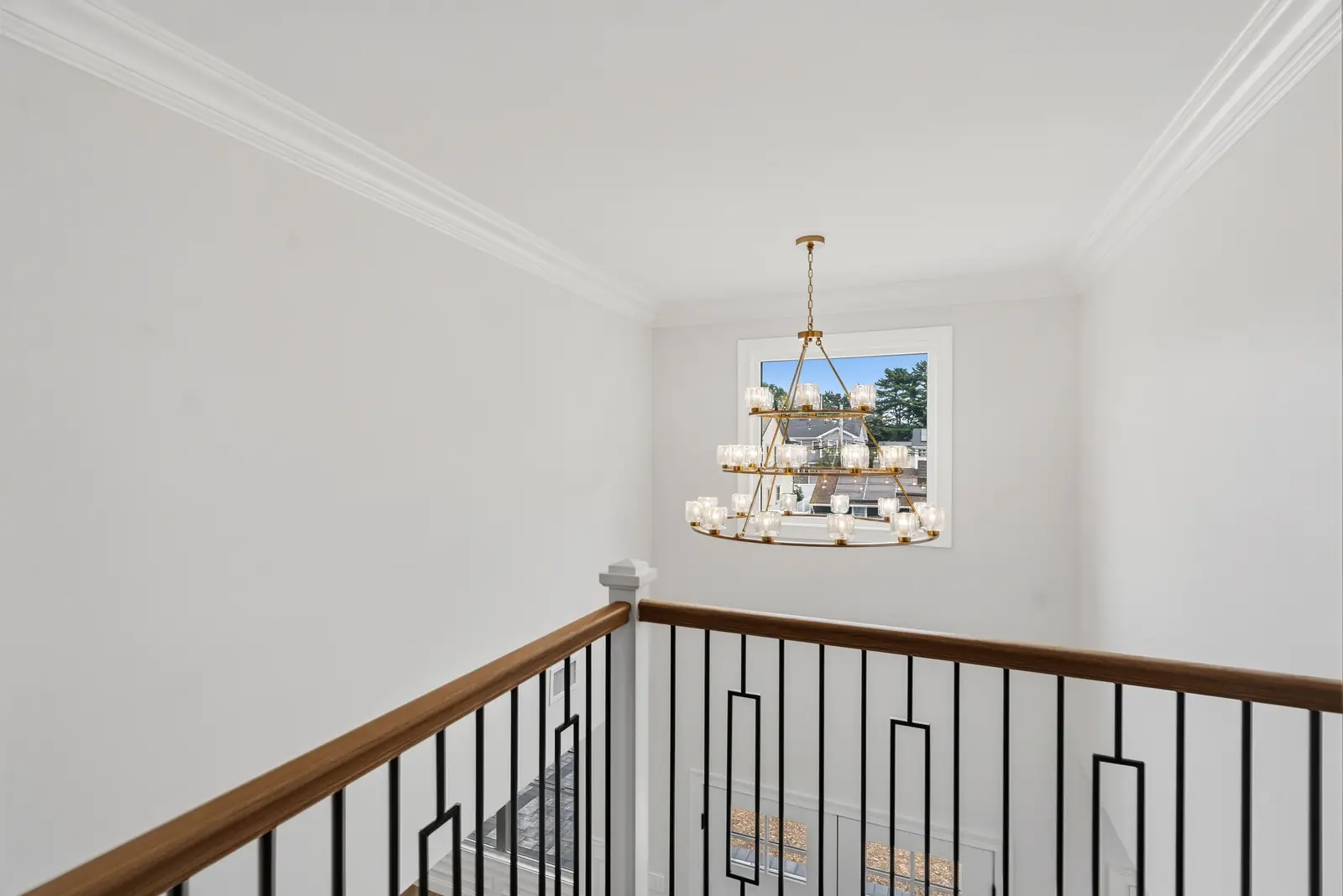 Syosset new construction — upstairs landing chandelier