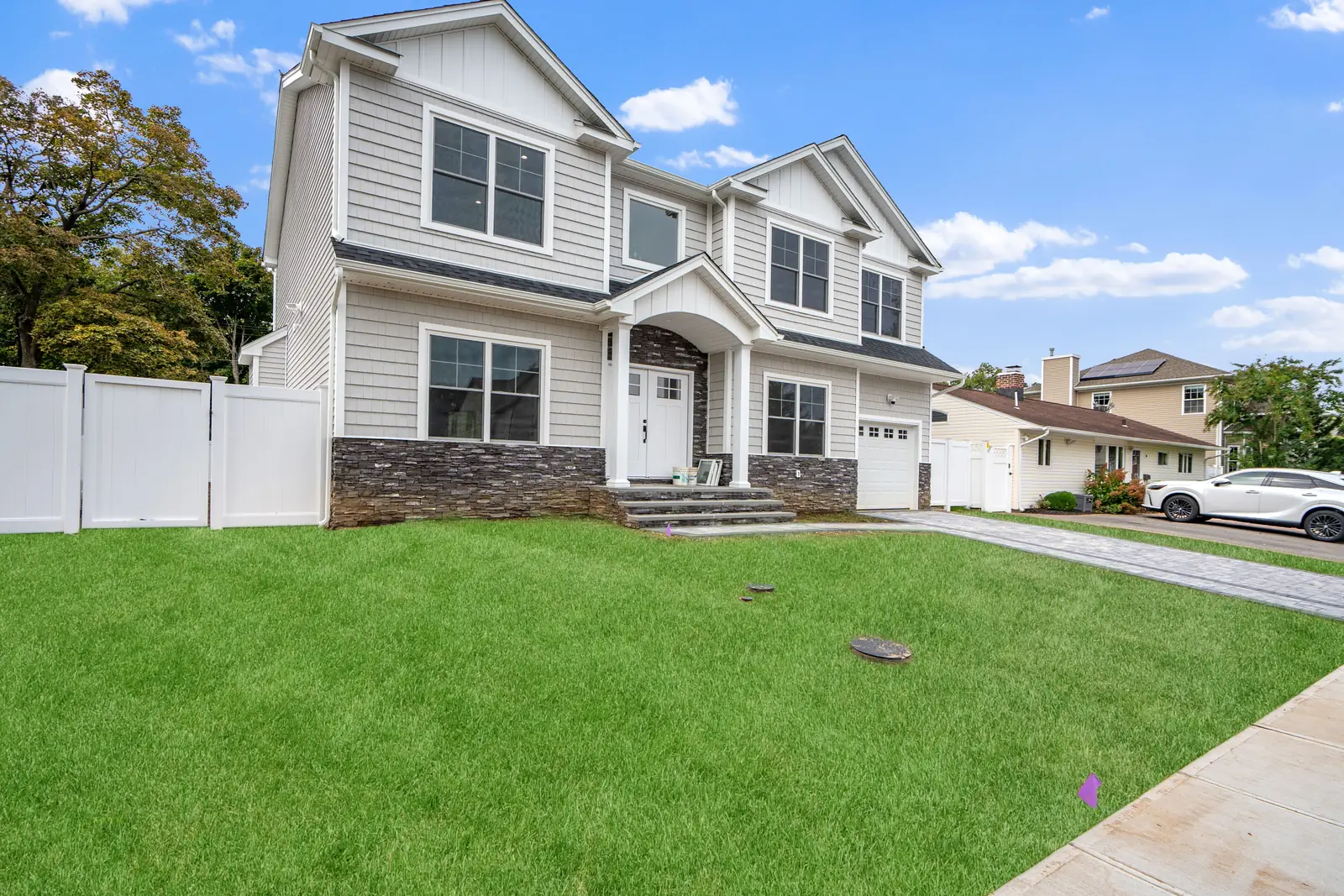 Syosset new construction — front exterior side view
