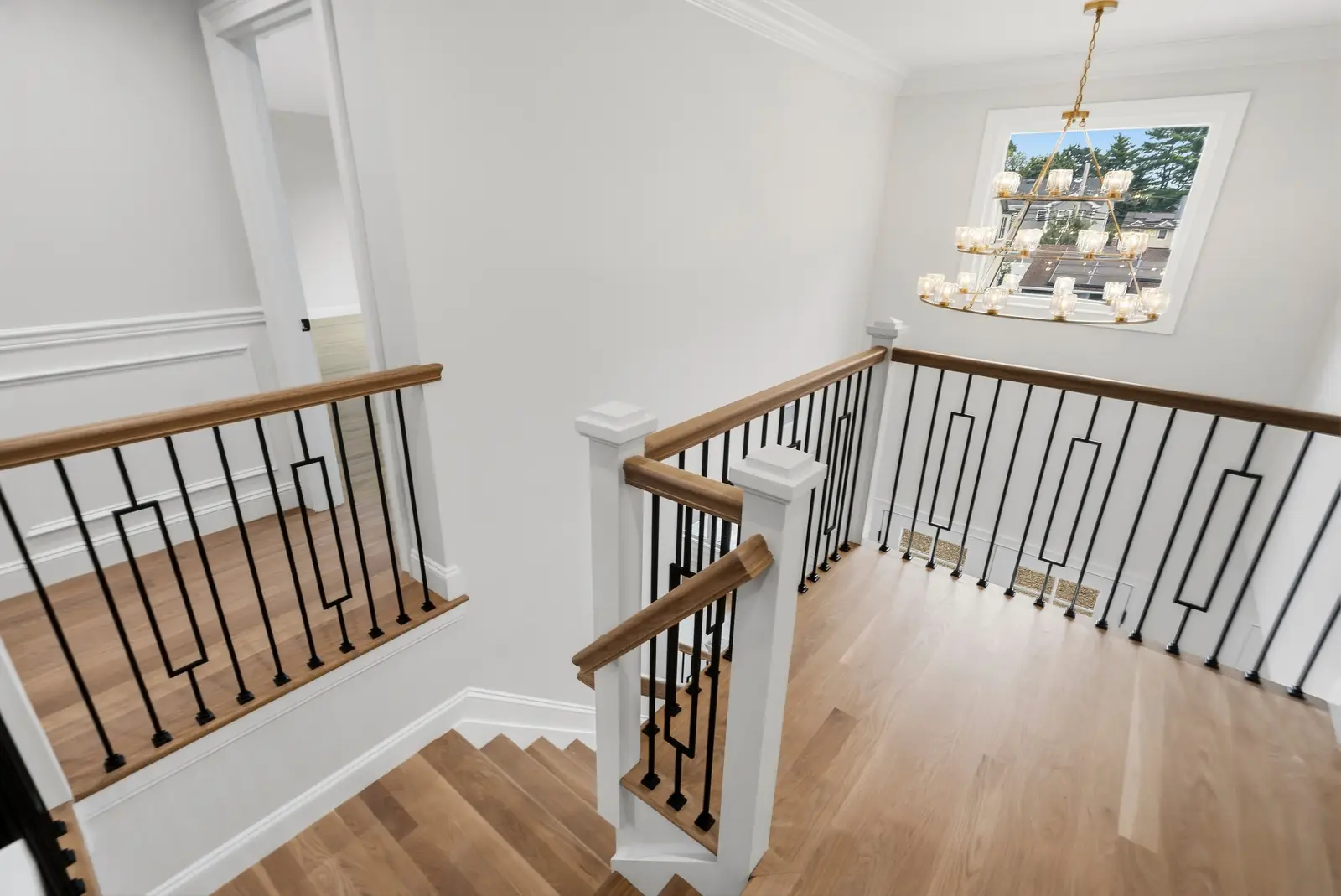 Syosset new construction — staircase and chandelier