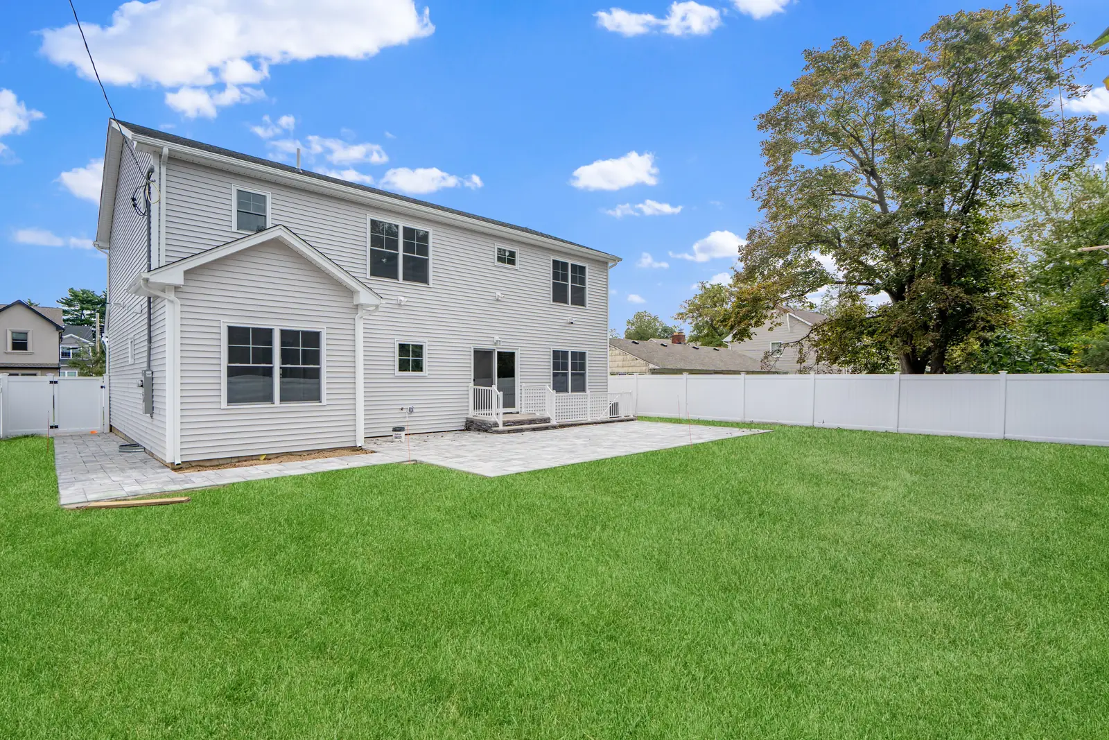 Syosset new construction — rear exterior and patio