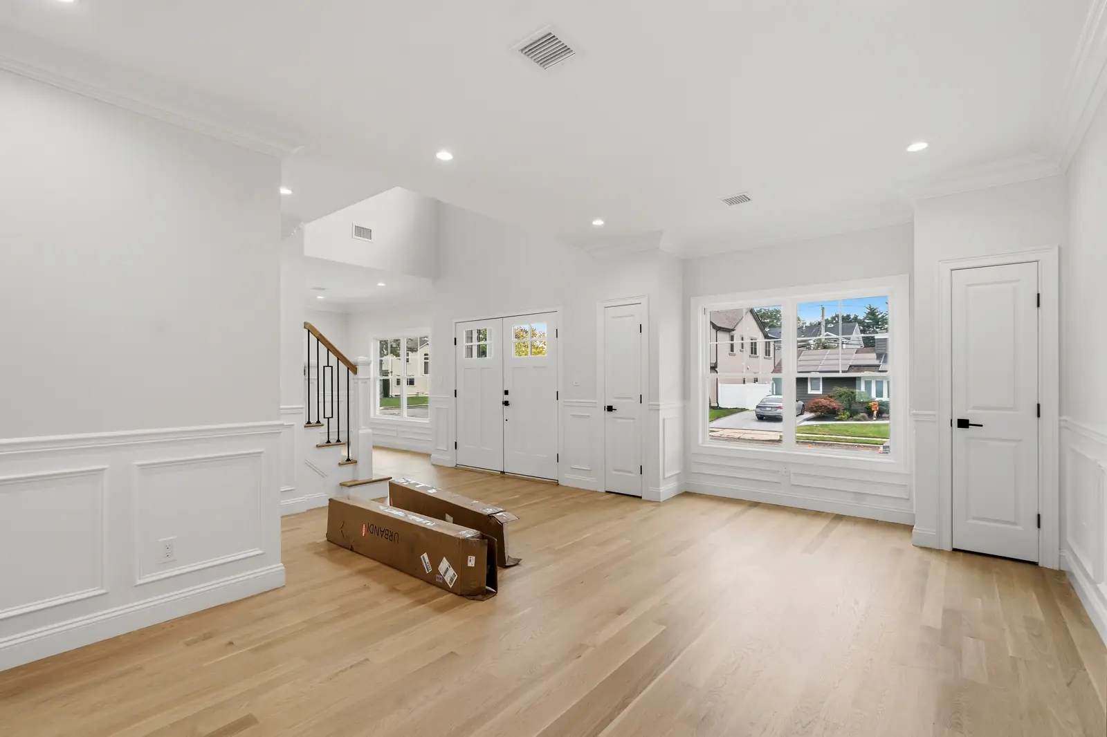 Syosset new construction — foyer and living room