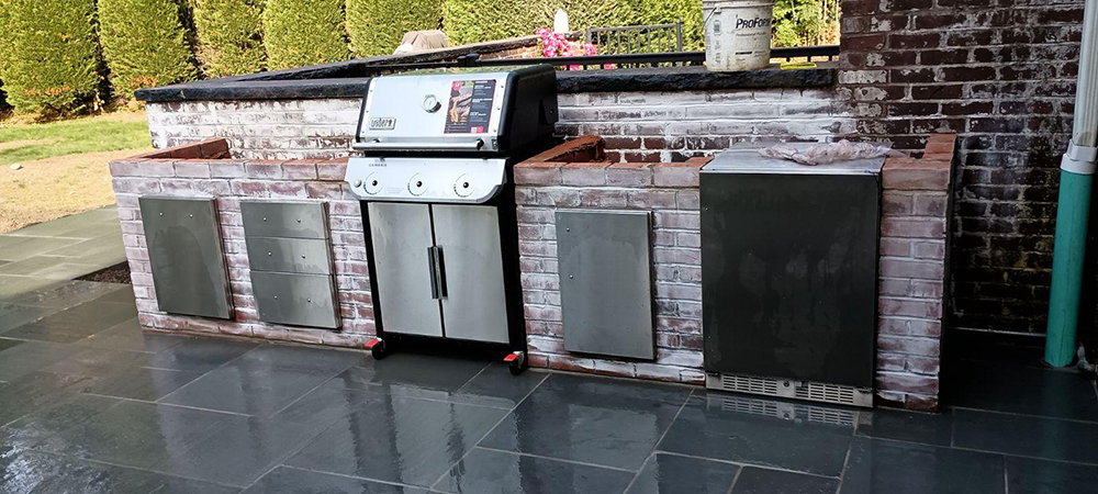 custom built brick and paver outdoor kitchen construction for hicksville home